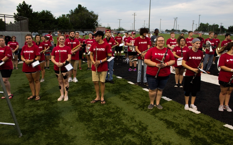 SNU's Marching Band playing on the football field at Siren