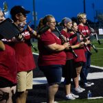 Woodwind section playing outside on SNU's football field