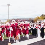 The SNU Football team running out onto the field