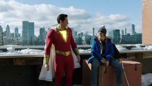 Shazam and his younger self on top of a building