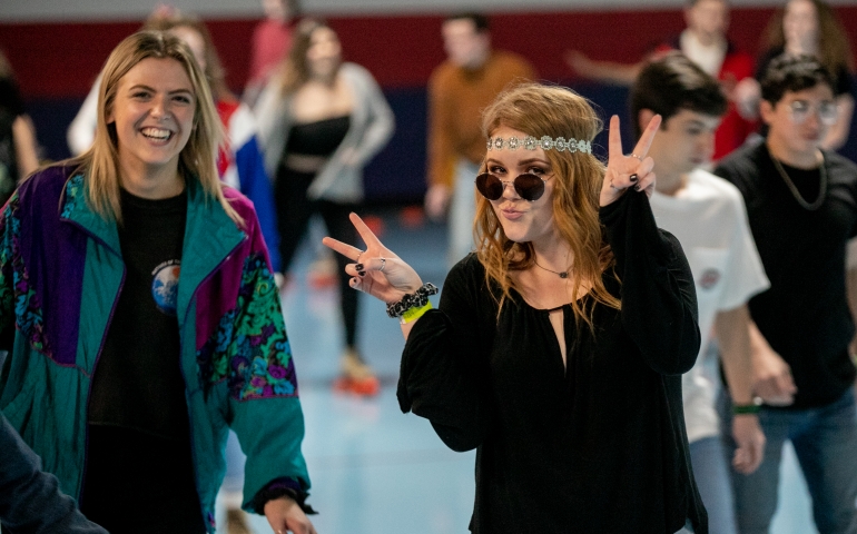 Two students posing as hippies at Roller Rag