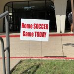 Poster outside of BFC that reads "Home SOCCER Game TODAY"