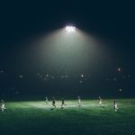 A soccer field at night