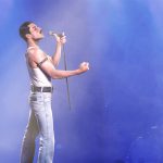 Photo of Freddie Mercury (Rami Malek) on stage performing