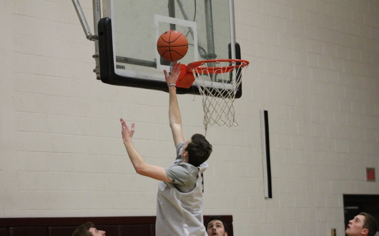 A student going to shoot a lay up