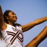 Cheerleader putting her leg in the air
