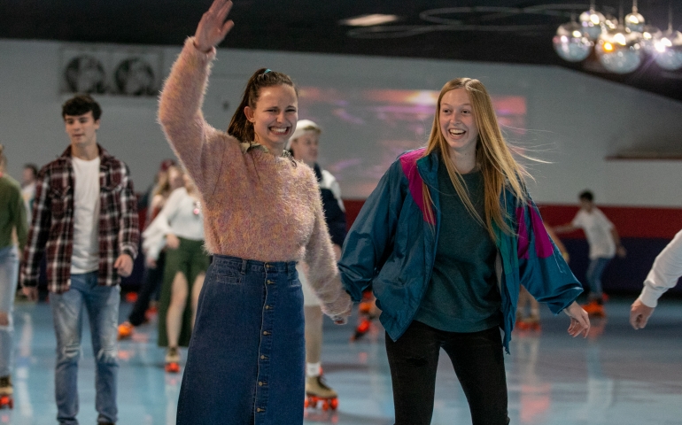Two female students skating at Roller Rag