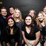Graphic design students at a professional photo booth at the Addy's