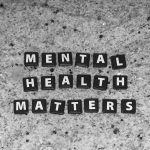 Scrabble tiles that spell out "Mental Health Matters"