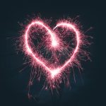 Pink fireworks shaped like a heart